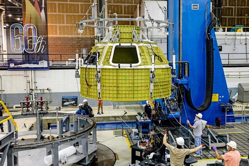 Orion crew module pressure vessel lifted from welding tool