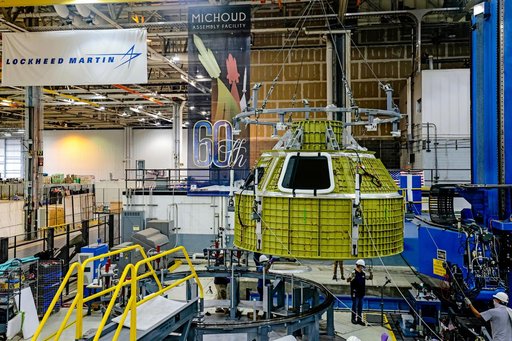 Orion crew module pressure vessel lifted from welding tool