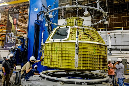 Orion crew module pressure vessel lifted from welding tool