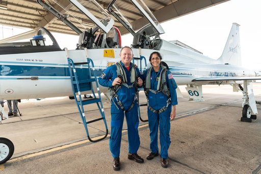 Suni Williams and Butch Wilmore pose with T-38