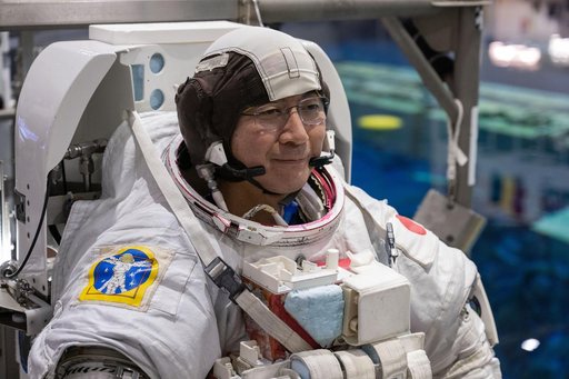 JAXA astronaut Kimiya Yui conducts training for a spacewalk