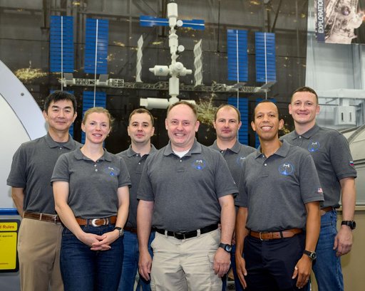 The Expedition 74 crew poses for a group photo after a training session