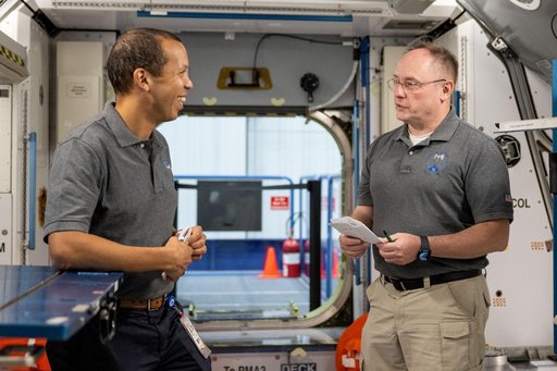 NASA astronauts Chris Williams and Mike Fincke participate in a training session