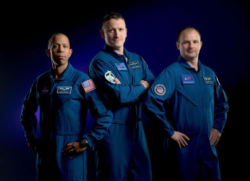 Expedition 74 crew members pose for a portrait at NASA's Johnson Space Center in Houston, Texas