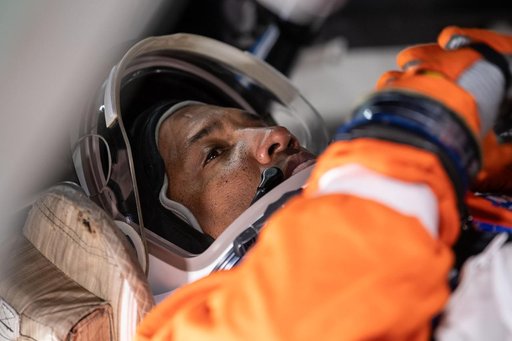 NASA astronaut and Artemis II Pilot Victor Glover inside of the Orion spacecraft mockup