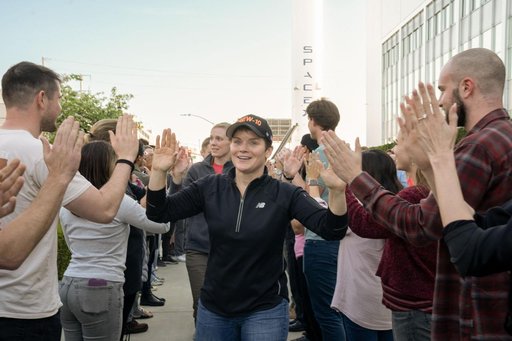 jsc2025e011328 - NASA astronaut and commander of NASA's SpaceX Crew-10 mission Anne McClain smiles and high fives SpaceX employees during a sendoff at the company’s facility in Hawthorne, California. Credit: SpaceX