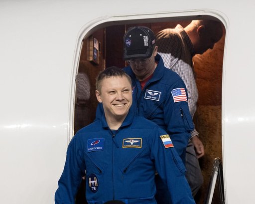 Roscosmos cosmonaut Aleksandr Gorbunov smiles as he returns to Johnson Space Center