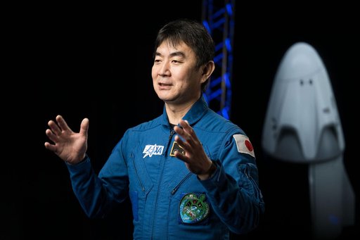 JAXA astronaut Kimiya Yui is photographed during an interview