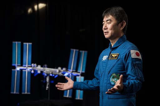 JAXA astronaut Kimiya Yui is photographed during an interview