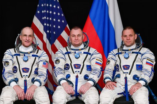 Soyuz MS-26 crew members pose for a portrait