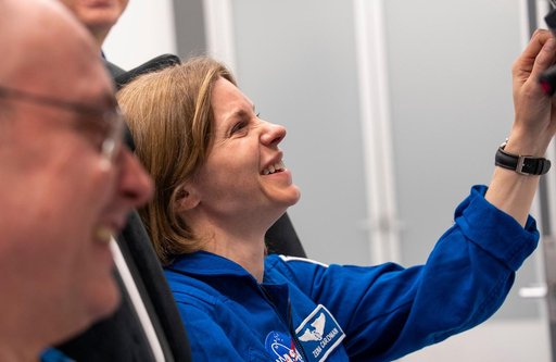 Astronaut Zena Cardman trains inside a Dragon training crew spacecraft