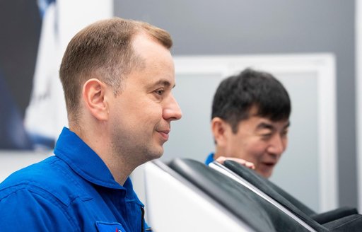 Cosmonaut Oleg Platonov trains inside a Dragon training crew spacecraft
