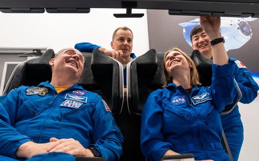 NASA's SpaceX Crew-11 members train inside a Dragon training crew spacecraft