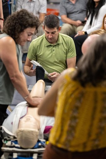 NASA astronaut Jessica Meir and Jack Hathaway practice cardiopulmonary resuscitation (CPR)