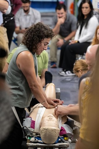NASA astronaut Jessica Meir practices cardiopulmonary resuscitation (CPR)