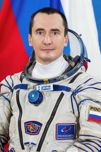 Soyuz MS-28 Backup Commander Pyotr Dubrov poses for a portrait in his Sokol launch and entry suit