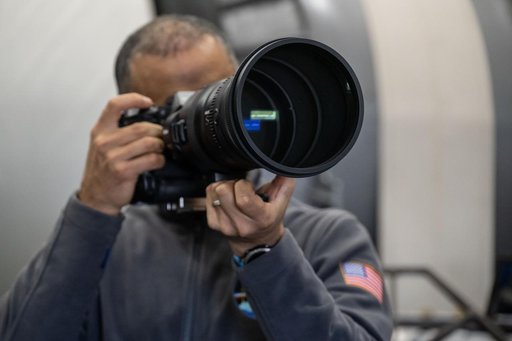 NASA astronaut Anil Menon participates in a photography training session