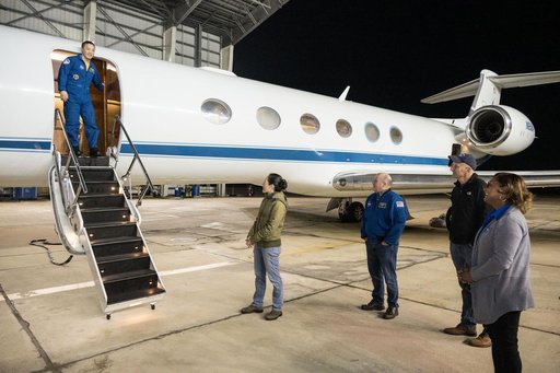 NASA astronaut Jonny Kim exits the Gulfstream V aircraft that returned him to Houston