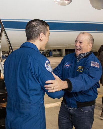 NASA astronaut Jonny Kim is greeted by Chief of the Astronaut Office Scott Tingle