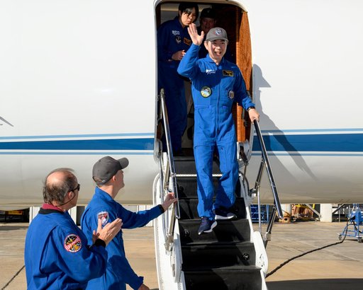 JAXA astronaut Kimiya Yui waves to officials at Ellington Field in Houston, Texas