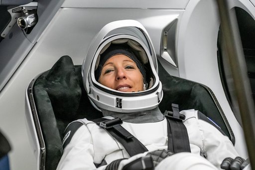 ESA astronaut Sophie Adenot is photographed inside the Dragon spacecraft