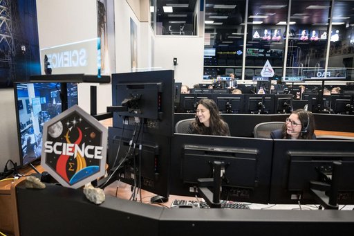 Artemis science officers watch lunar science team celebrating -- jsc2026e020499