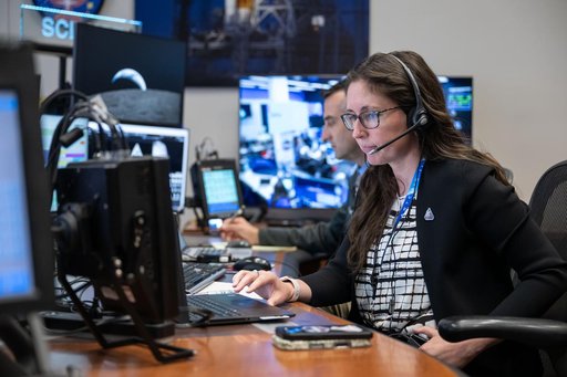 Artemis II science officers, Trevor Graff, background, and Kelsey Young -- jsc2026e021212