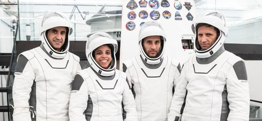 The SpaceX Crew-13 members pose for a portrait in their pressure suits
