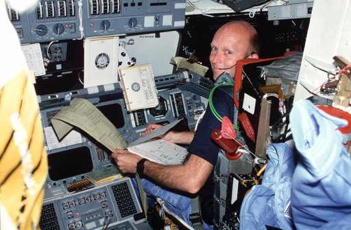 Pilot Fullerton reviews FDF and TAGS printout on forward flight deck