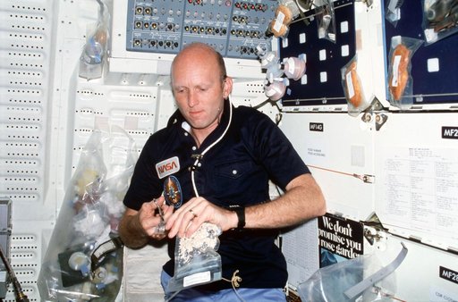 Pilot Fullerton prepares meal on middeck