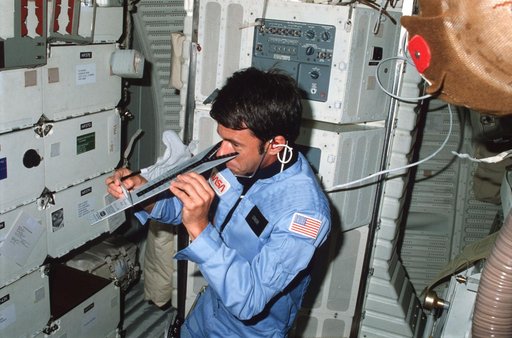 Mission Specialist Lenoir checks vision using DIOPTER measuring device