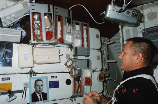 Pilot Overmyer looks over food selections and experiments with beverage