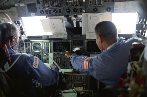 Commander Brand and Pilot Overmyer operate controls on forward flight deck