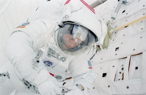Mission Specialist (MS) Musgrave works at PLB forward bulkhead during EVA