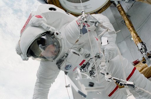 MS Musgrave adjusts EVA crewmember safety tether reel in aft PLB