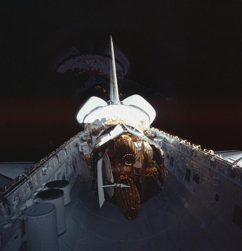 Reflected view of the TDRS in the STS-6 Challengers payload bay