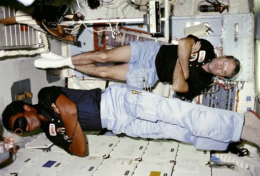 Commander Truly and Mission Specialist (MS) Bluford sleep on middeck