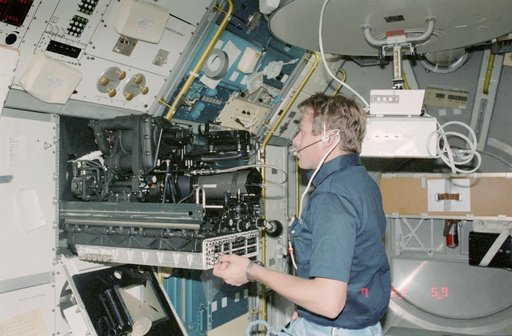 Payload Specialist Byron K. Lichtenberg working in the Spacelab