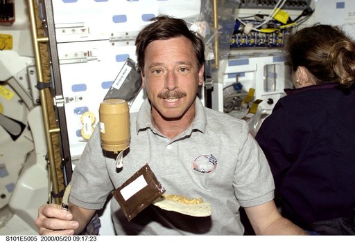 PLT Horowitz on middeck with jar of peanut butter