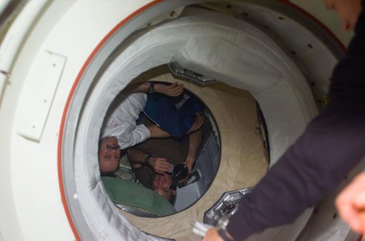 Expedition Two crew  greet STS-104 crew at PMA-2 hatch