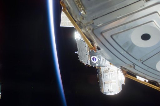 Quest airlock maneuvered into position