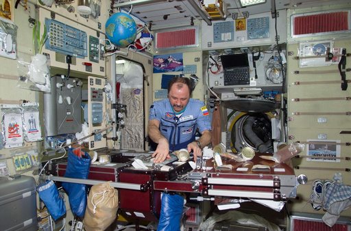 Usachev at ward room table in Service Module