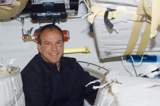 Commander Bloomfield poses on the middeck of Atlantis during STS-110
