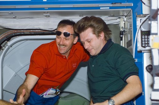 Onufrienko welcomes Smith in Destiny during STS-110's initial ingress into the ISS