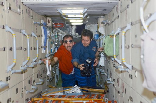 Bursch and Smith pose in the FGB during STS-110's visit to the ISS