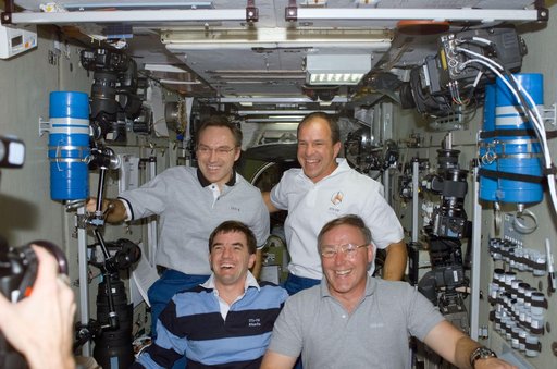 Walz, Bloomfield, Walheim and Ross pose in Zvezda during STS-110's visit to the ISS