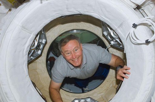 Ross drifts through the ODS hatch to the ISS during STS-110