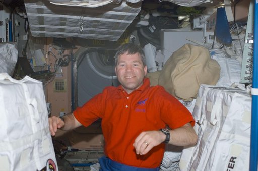 Frick poses among SAFER stowage bags in Node 1 during STS-110's visit to the ISS