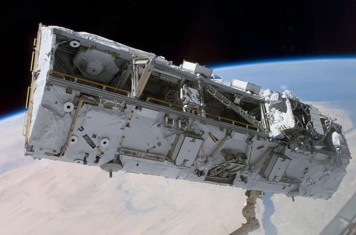 View of the S0 Truss being moved into installation position by the SSRMS during STS-110