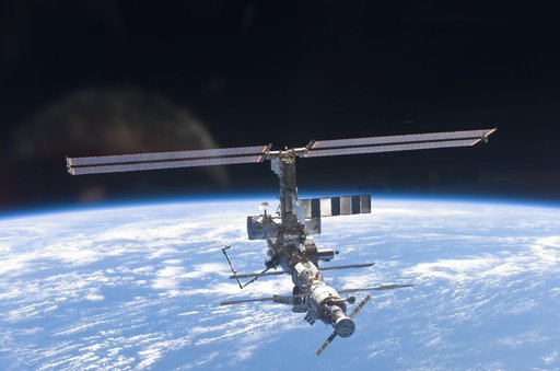 Aft - zenith view of the ISS taken during STS-110's undocking and final flyaround